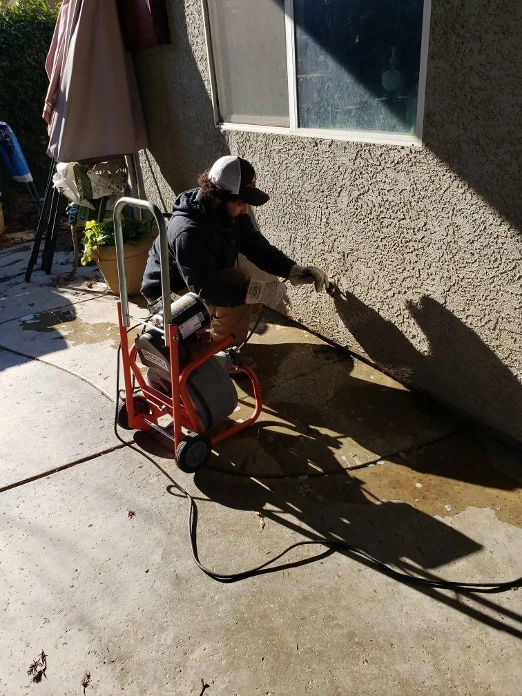 AccuFlow tech performing drain cleaning