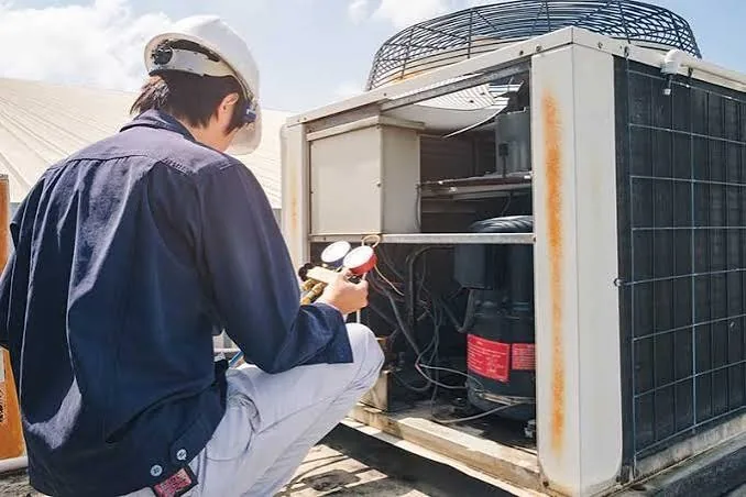 AccuFlow tech installing an HVAC unit