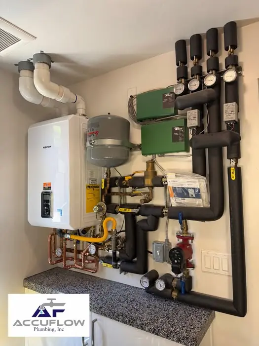 Navien combi-boiler installation with insulated piping, pumps and expansion tank